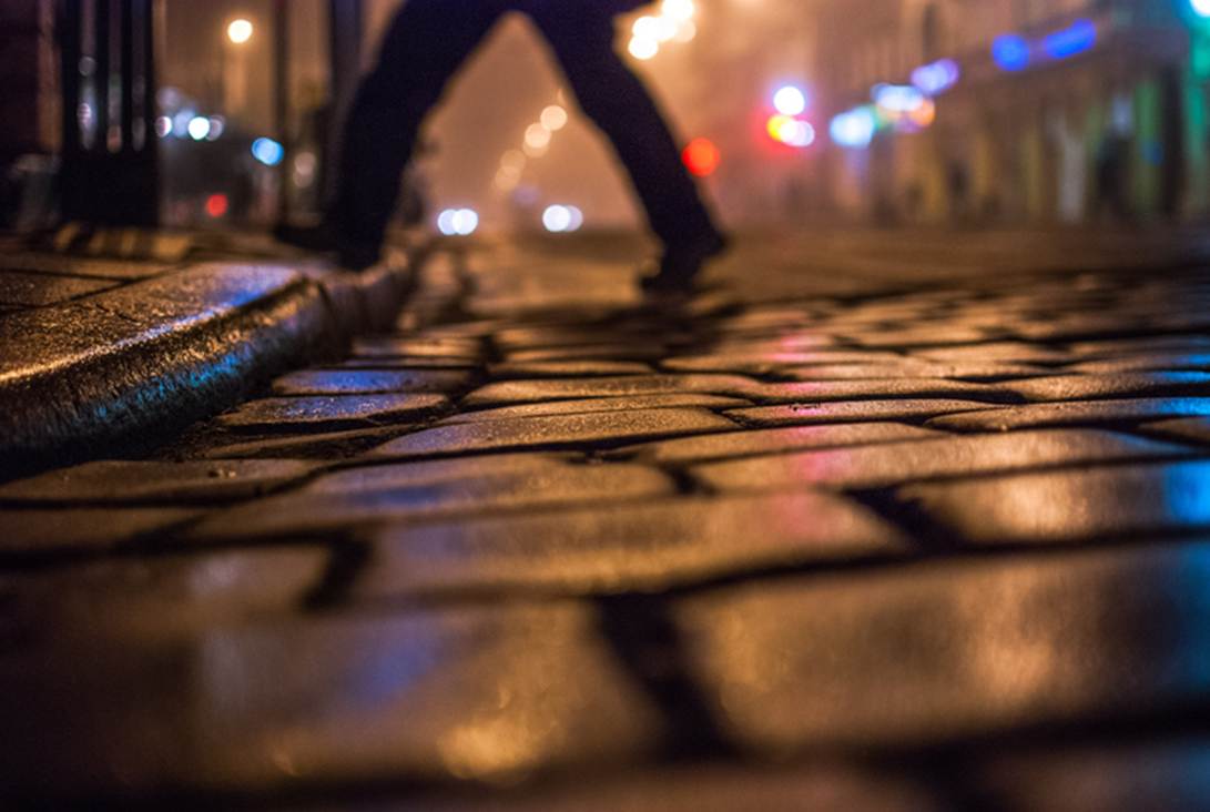 A person walking on a wet sidewalk

AI-generated content may be incorrect.